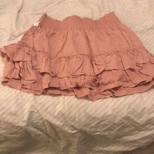 A ruffled knit pink mini skirt.